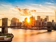 Booking.com Reveals Top Property Types and Destinations on the Minds of Home-Bound Canadians Brooklyn Bridge and the Lower Manhattan skyline at sunset, as viewed from Manhattan Bridge