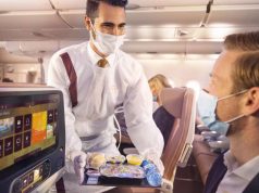 ETIHAD AIRWAYS LAUNCHES HEALTH AND HYGIENE PROGRAMME CHAMPIONED BY NEW WELLNESS AMBASSADORS Etihad Crew onboard with PPE serving guests