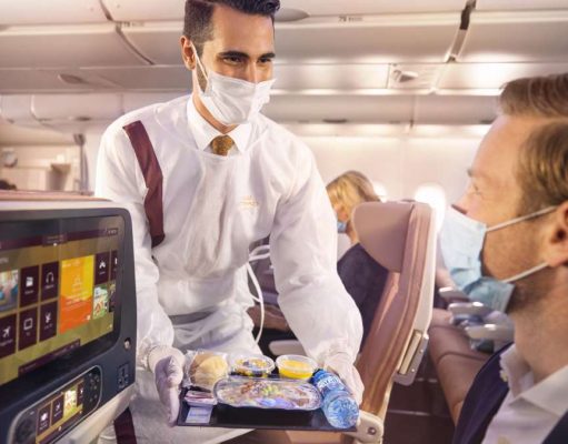 ETIHAD AIRWAYS LAUNCHES HEALTH AND HYGIENE PROGRAMME CHAMPIONED BY NEW WELLNESS AMBASSADORS Etihad Crew onboard with PPE serving guests