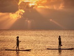 Cayman Islands Tourism Reinvention Plan Announced Paddleboarding at sunset