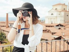 An Ultimate Guide to Write a Tour Guide Resume gril taking oictures while traveling