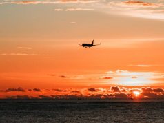 British Airways named 5th Best Airline in the World according to eDreams airplane flying off in the sunset
