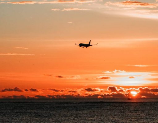 British Airways named 5th Best Airline in the World according to eDreams airplane flying off in the sunset