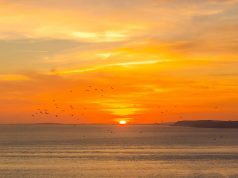 UK’s top five most beautiful sun-watching locations sunsetting over the ocean in Dorset UK