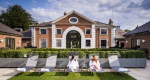 girls on lounge chairs outside a UK spa