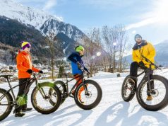 Experiences for Non-Skiers to Enjoy in the Italian Alps a group of people riding on fat tire bikes
