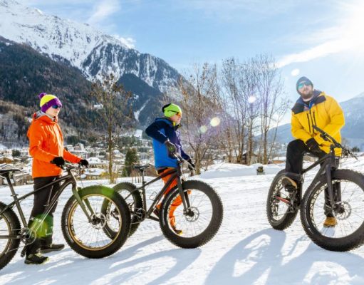 Experiences for Non-Skiers to Enjoy in the Italian Alps a group of people riding on fat tire bikes