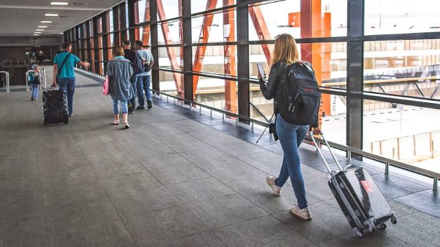 Image Russpass Tourist Resource Gains Three New Features tourist at airport in Russia