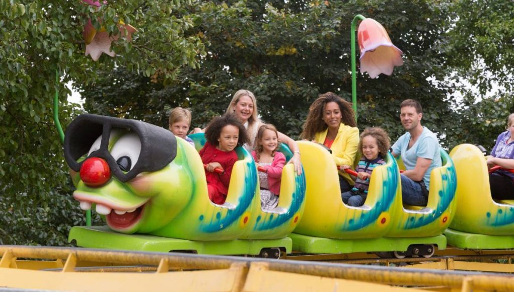children riding a theme park ride