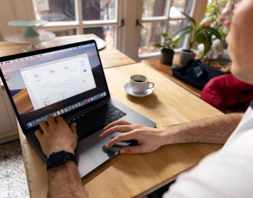 Work remotely and still enjoy your traveling experience with these top tips person working remotely on a laptop
