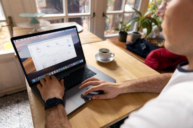 person working remotely on a laptop