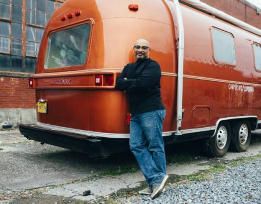 How to Set Up a Toilet in Your RV man standing beside his RV trailer