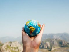 5 Habits you can do to make this Earth Day a little more “Green” earth day person holding a globe