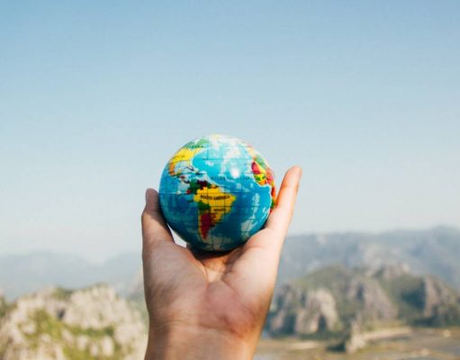 5 Habits you can do to make this Earth Day a little more “Green” earth day person holding a globe