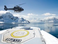 New Ultra-Luxury Polar Antarctica Expeditions Feature Helicopter Landings helicopter landing on the front of a luxury cruise ship