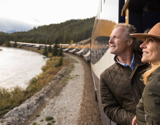 Rocky Mountaineer & Fairmont Hotels Launch Canadian Resident Promo couple riding the luxury train Rocky Mountaineer