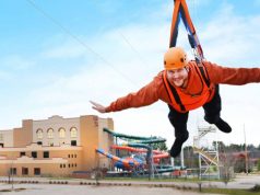 The Longest Head-First Racing Zipline Course in USA Set to Open man on a zip line