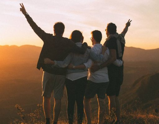 How to Travel More Sustainably friends watching a sunset while travelling