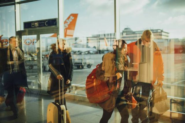 travellers in a busy airport