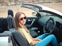 9 Best Accessories To Customize Your Car Before a Trip girl in a convertible car