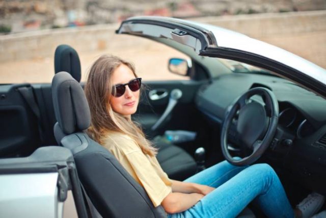 girl in a convertible car