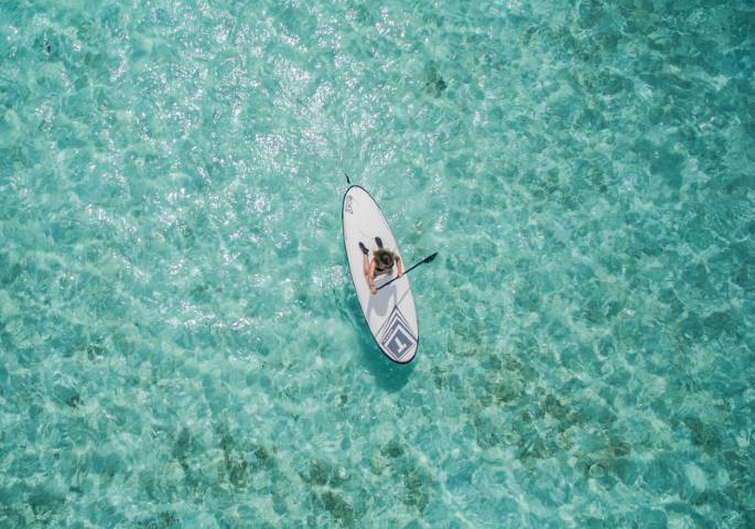 person on a stand up paddle board