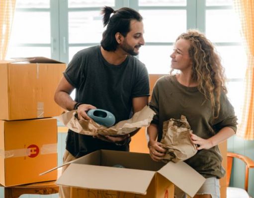 Moving and Packing Tips to Make Your Move Less Stressful couple packing boxes