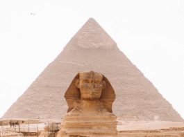 sphinx with pyramid in the background