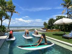 Noku Beach House Stars in New Netflix Series paddleboard yoga at Noku Beach House Bali