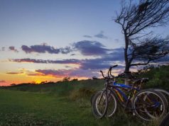 World Expeditions Launches a New Range of North American Adventures biking at suneset in the Hamptons
