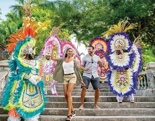 Travel to The Bahamas with Ease People in the Bahamas dancing at carnival