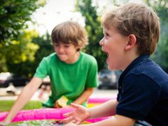 5 Practices to Boost Your Kids’ Language Skills While Traveling kids laying while traveling