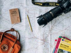 Funding a Travel Lifestyle: Ways to Make It Happen tavelling map bag, camera, travel guides