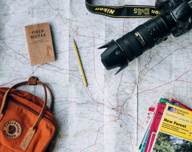 tavelling map bag, camera, travel guides