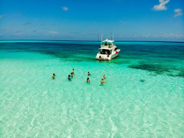 people paying in the water in Cancun