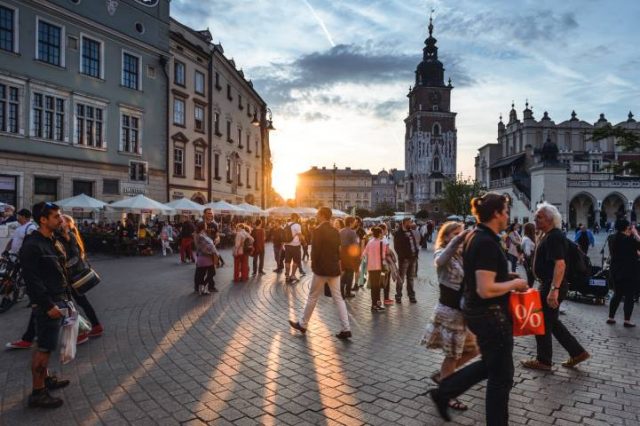 Tourists on Main Market Square in Krakow, Poland.