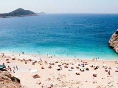 Top 3 countries to go without being vaccinated people on a beach in Turkeyy