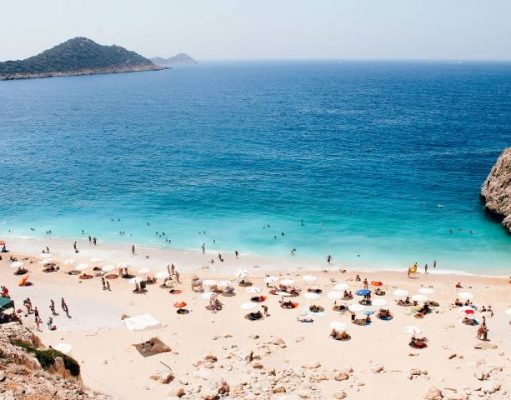 Top 3 countries to go without being vaccinated people on a beach in Turkeyy