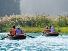 Everything You And Your Friends Can Do On A Lake To Have Fun people on a lake in a small boat