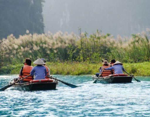 Everything You And Your Friends Can Do On A Lake To Have Fun people on a lake in a small boat