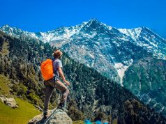 Important Items That Travelers Must Keep With Them for an Easier Travel Experience a man hiking in the mountains