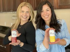 Just Enough Wines is More Than Canned Wine holding cans of Just Enough Wine