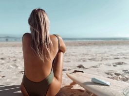 girl sunbathing on a beach