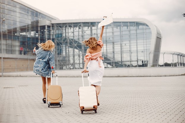 tow girls running to catch a plane