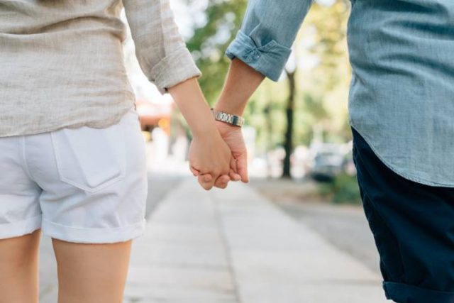 couple walking and holding hands