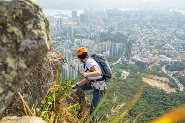 rock climbing with an Able Carry backpack