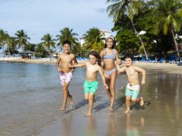 kids running on a beach in St Lucia
