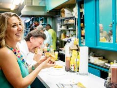 Foodie Travel | Alabama, a Must-Try Destination lady eating a hotdog in a diner