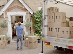 Can a moving company be a logistics company? man moving packing boxes