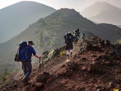 Top 7 Reasons to Consider A Mountain Adventure Trip This Year hiking on a mountain side